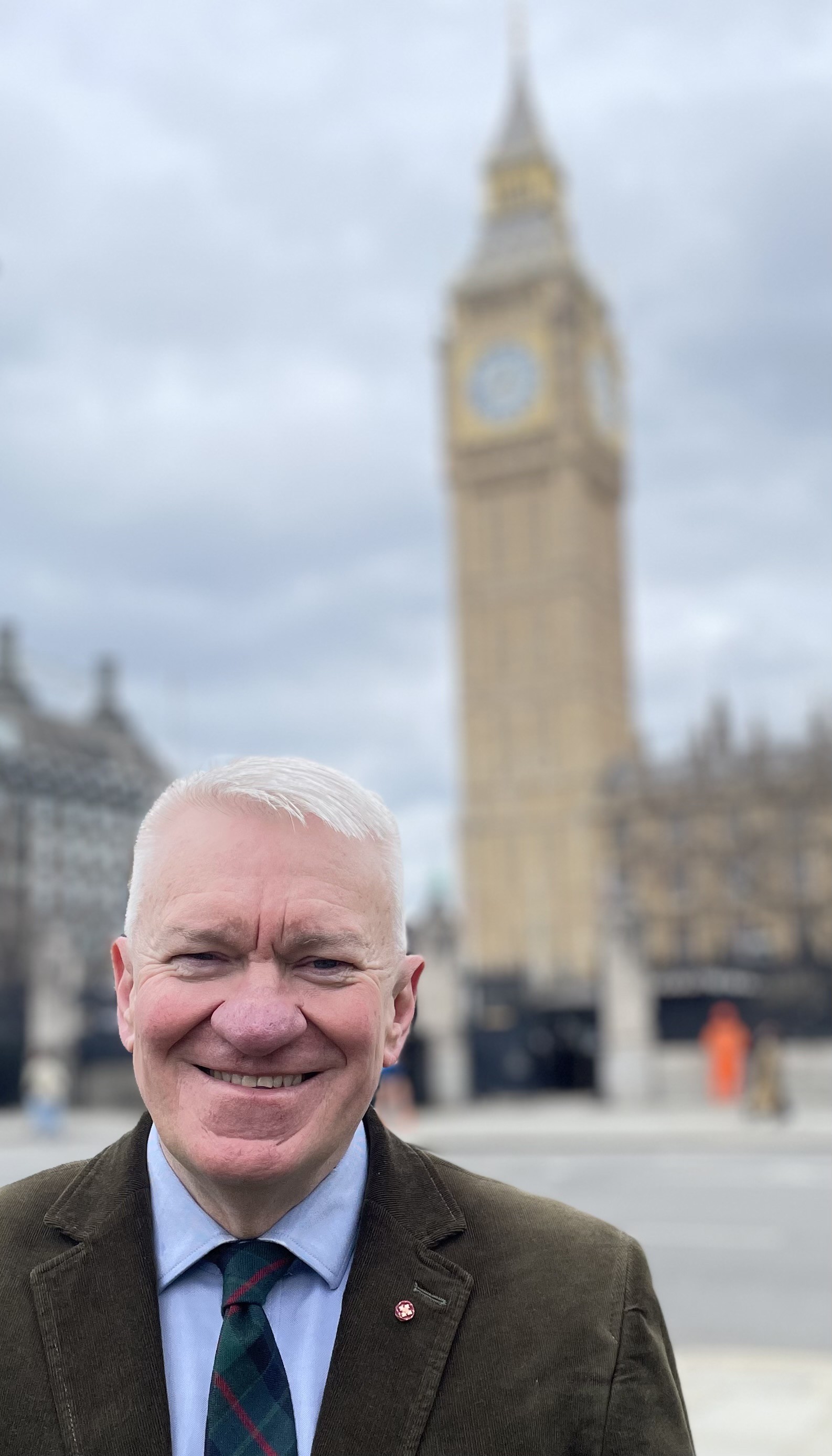 Image of Ray smiling, standing in front of Big Ben
