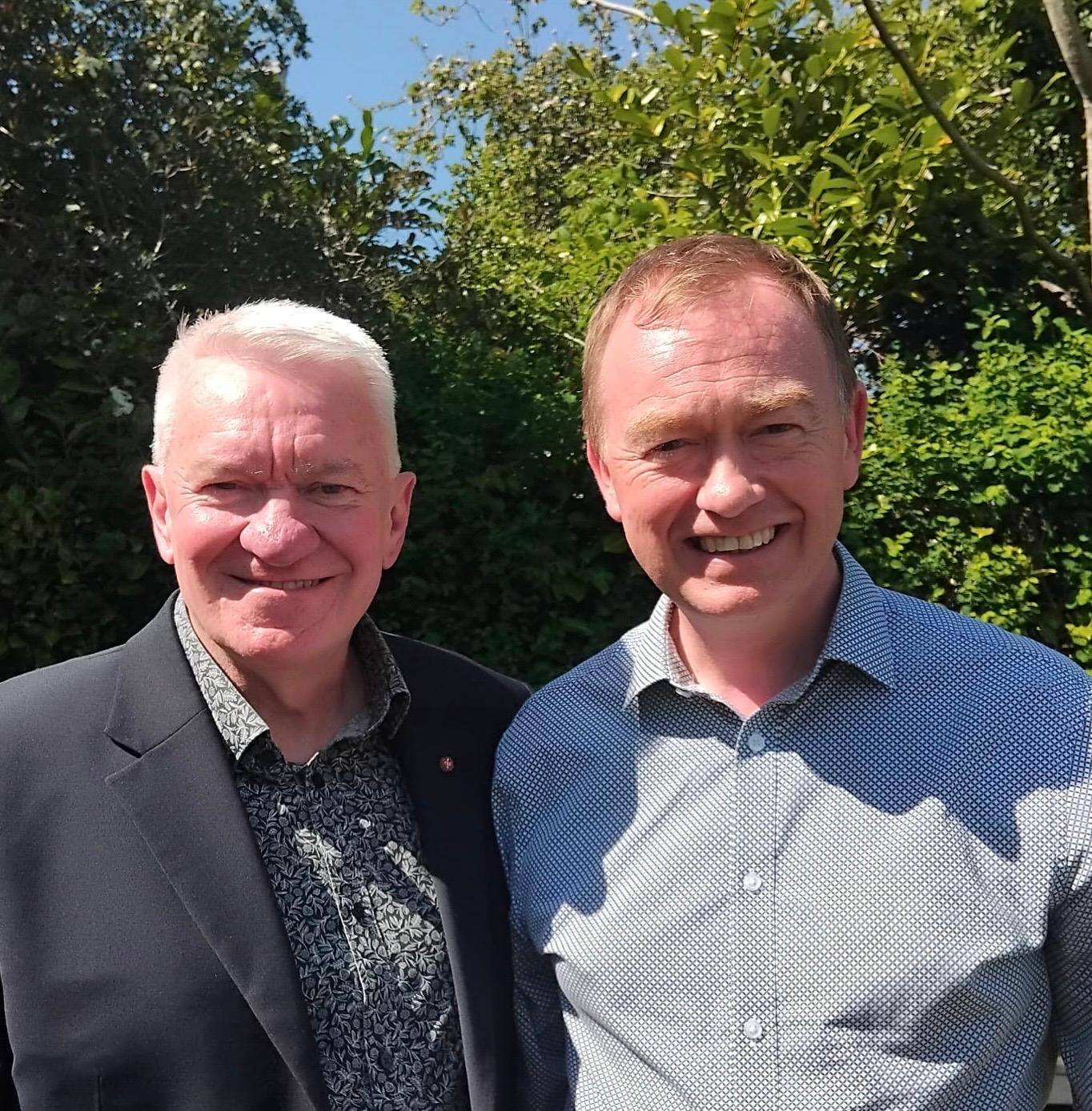 A photo of Ray with Tim Farron standing in front of trees