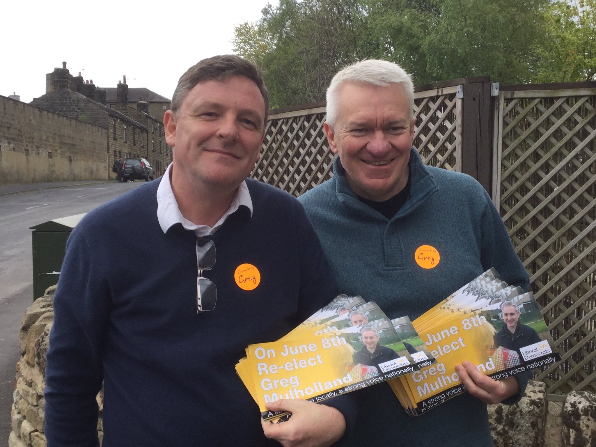 A photo of Ray with another man, holding election flyers
