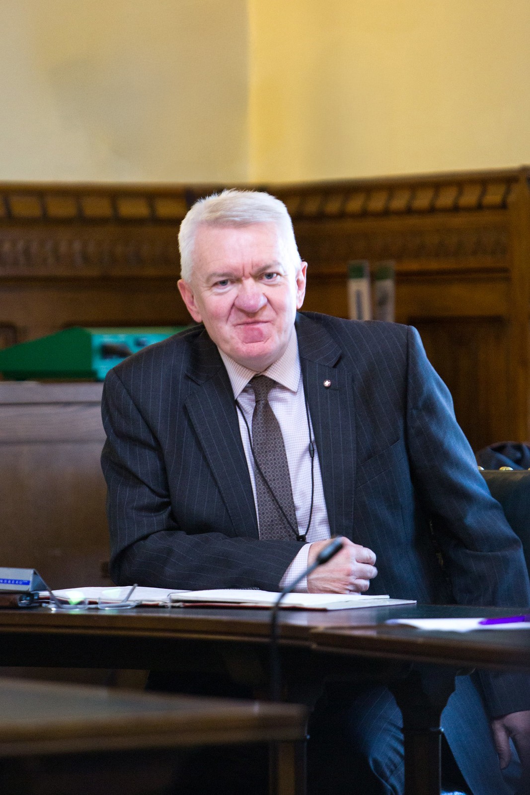 Photo of Ray facing the camera, wearing a suit